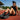 Female runner relaxing on an outdoor running track wearing Dynafish Dyna Super Black performance running shoes with lightweight cushioning and breathable mesh upper