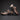 ASICS Gel-Nimbus 10.1 Black Rose Gold sneakers stacked in studio lighting showing side profile and cushioning