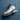 Nike Air Jordan 9 Cool Grey White Blue men’s sneaker angled view with grey and white upper